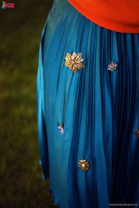 vintage brooch on blue skirt